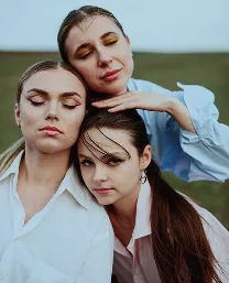 three woman in green field